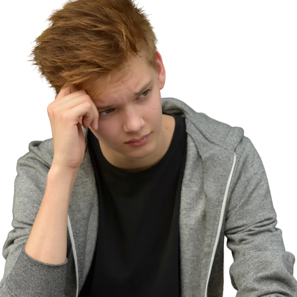 Adolescent se tenant la tête, en proie à de la tristesse.