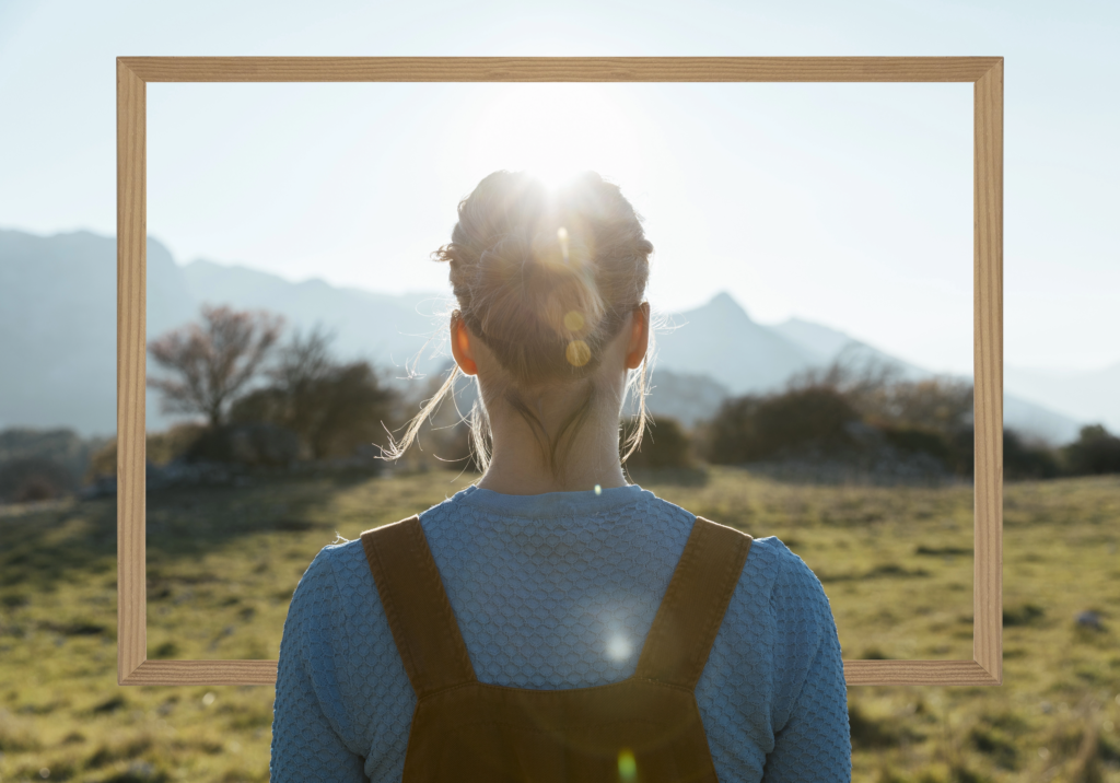 person-holding-frame-with-open-nature-landscape-concept