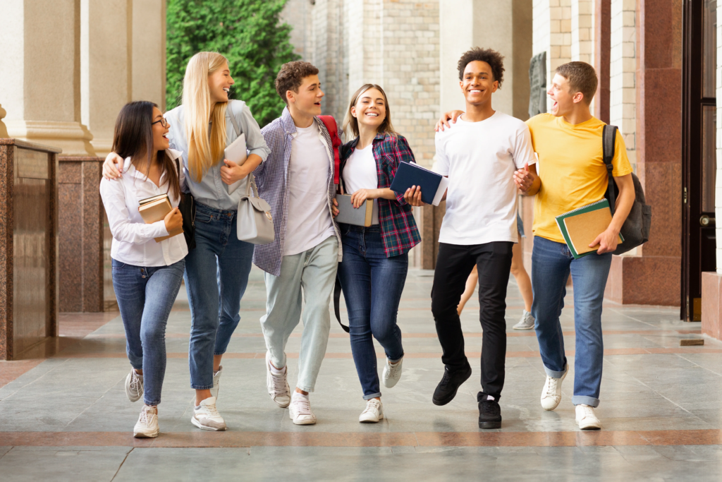 successful-tests-students-walking-university-campus-chatting-outdoors